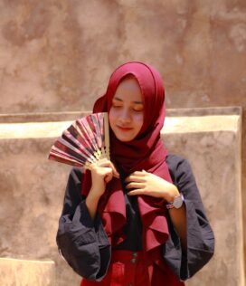 woman in red hijab and black long sleeve shirt