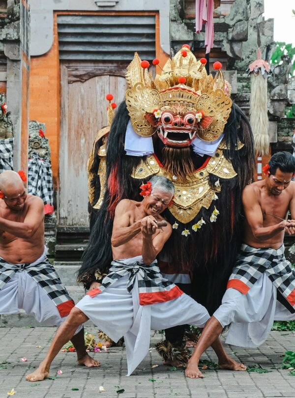 A group of men performing a dance in front of a building
