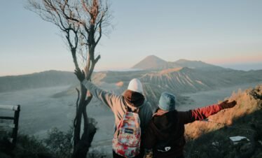 two person looking at mountains