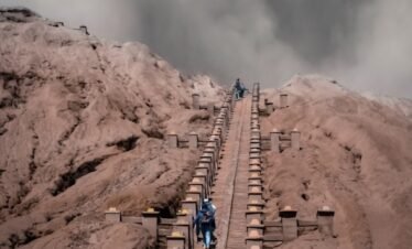people walking on brown rocky mountain during daytime