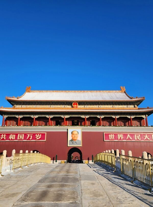 A large building with flags flying in the background