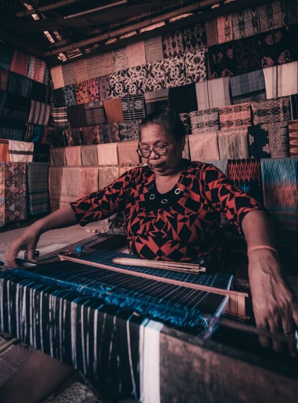 man in black and red crew neck t-shirt playing piano
