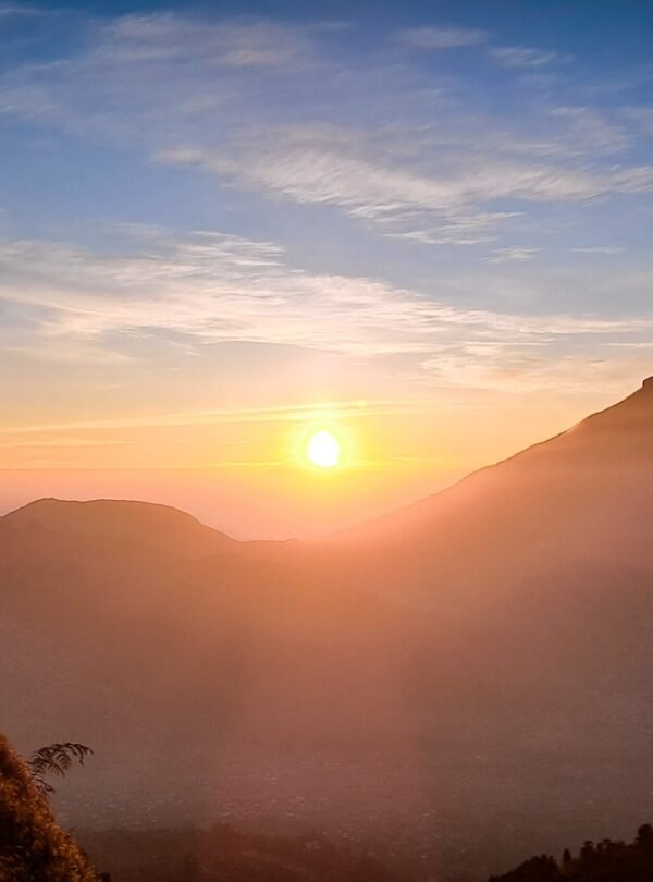a group of people standing on top of a mountain